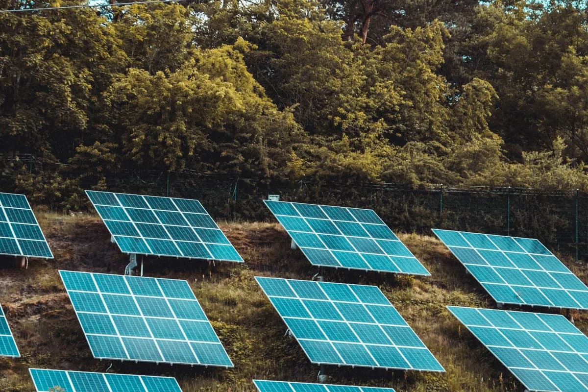 High-efficiency modern rooftop solar photovoltaic panel installation on a contemporary house under clear blue sky