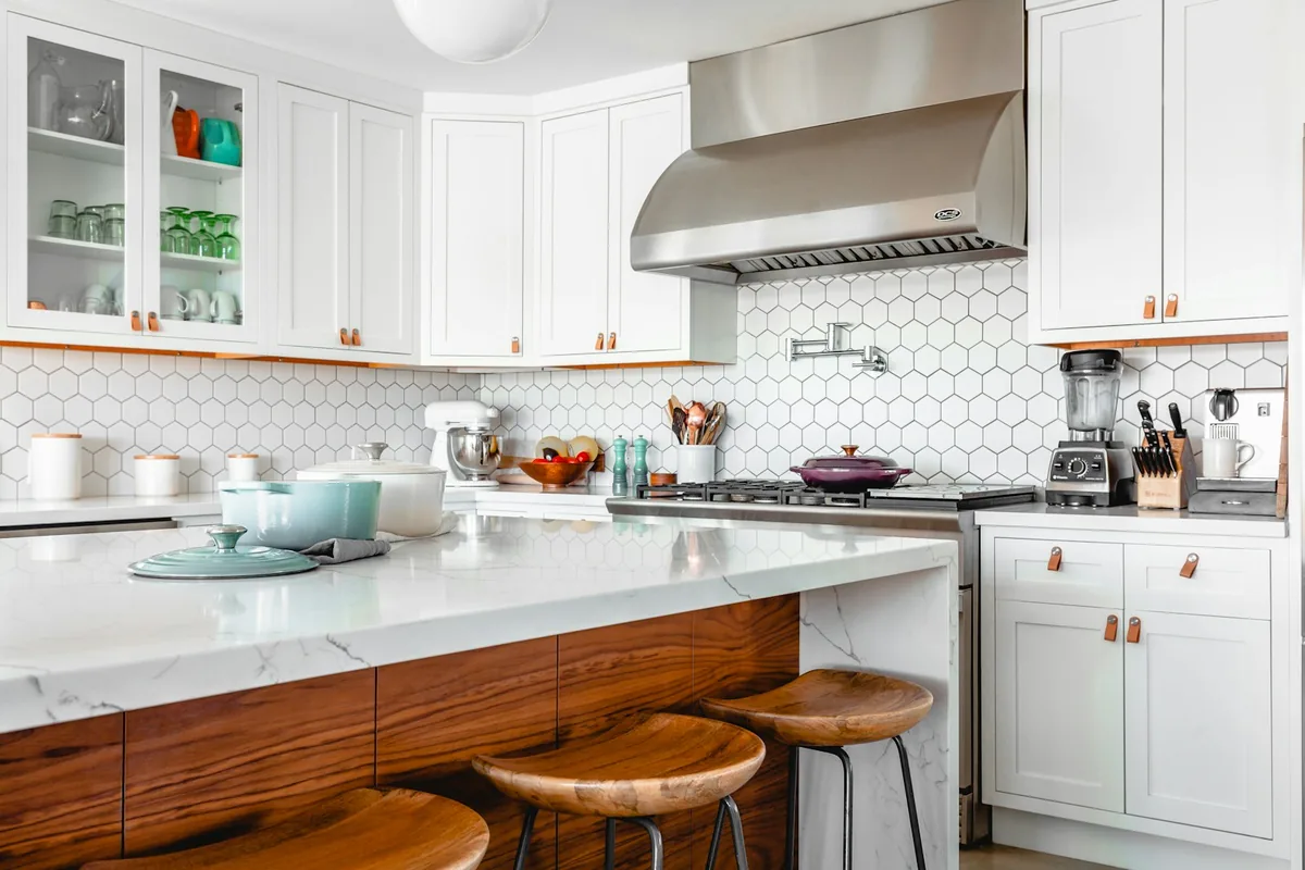 Sleek eco-friendly kitchen featuring energy-efficient induction cooktop and high-rated stainless appliances